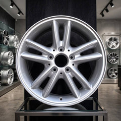 16x7 inch Mercedes C230 rim ALY65260. Silver wheel part# A2034010202, pictured in the showroom floor.